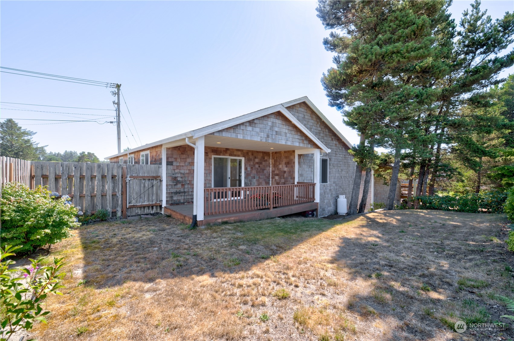 206 Pioneer Road West Long Beach, WA 98631 - Photo 28 of 39 a view of a house with backyard and trees
