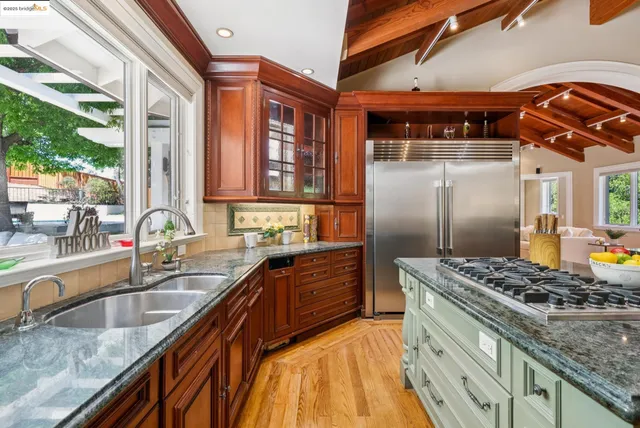 a room with lots of wooden furniture and windows