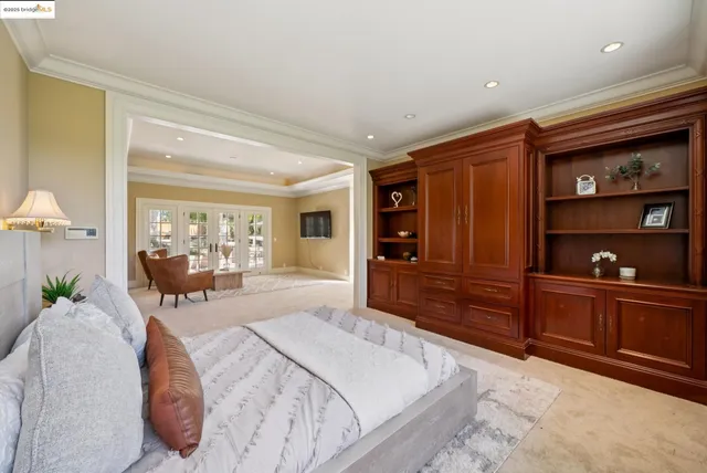 a bathroom with a tub shower and windows