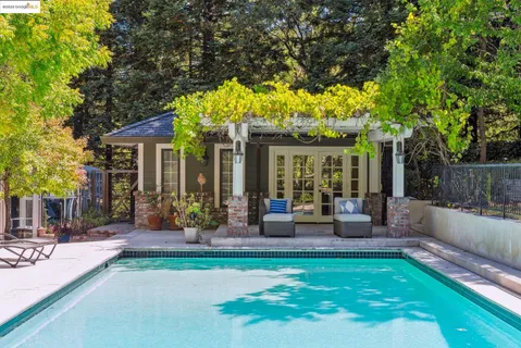 a view of a swimming pool with chairs