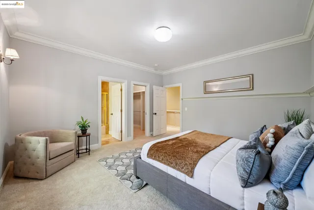 a bedroom with bed and a window