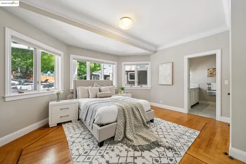 a bedroom with a bed and a couch