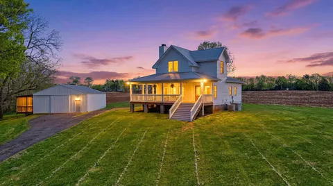 a view of a house with a big yard