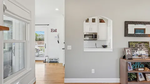 a view of livingroom with furniture and workspace