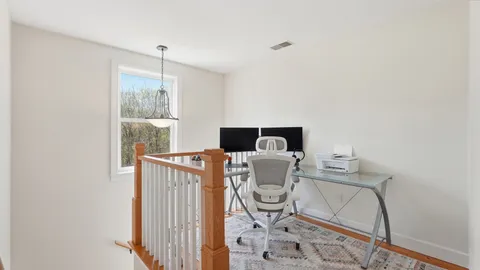 a workspace with furniture and window