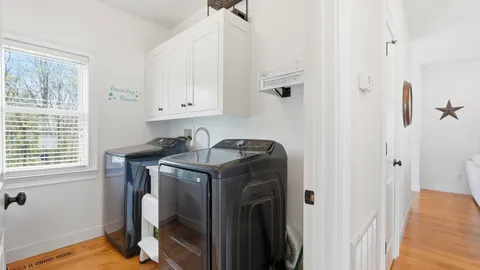 a utility room with a window dryer and washer