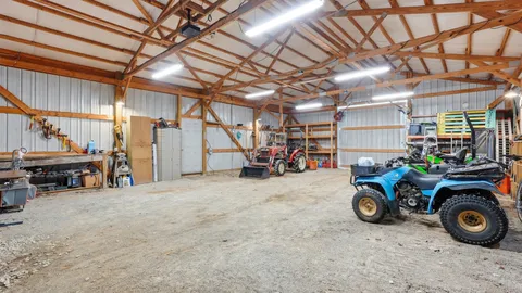 a view of a garage with a car and a bike