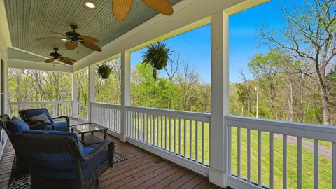 a view of balcony with furniture