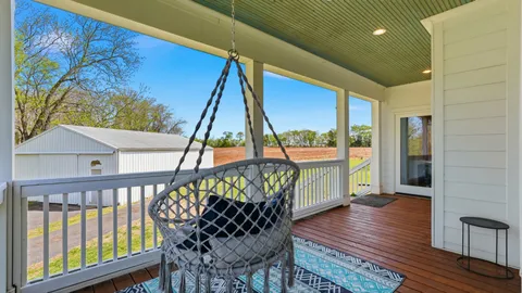 a view of a balcony with furniture