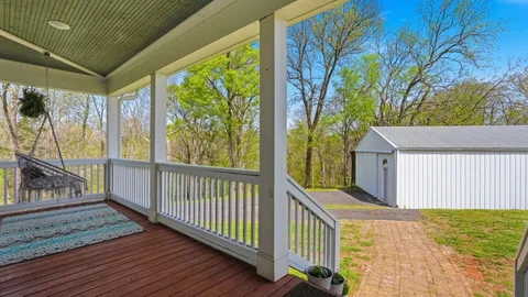 a view of a balcony with wooden floor