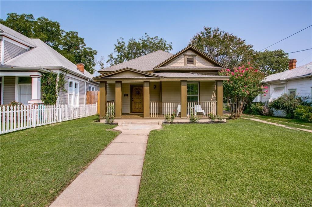a front view of a house with a yard and porch