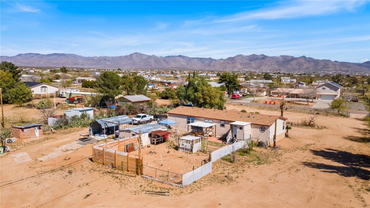 3411 Mayer Road Golden Valley, AZ 86413 - Photo 30 of 49 Aerial perspective of suburban area featuring a mountain backdrop