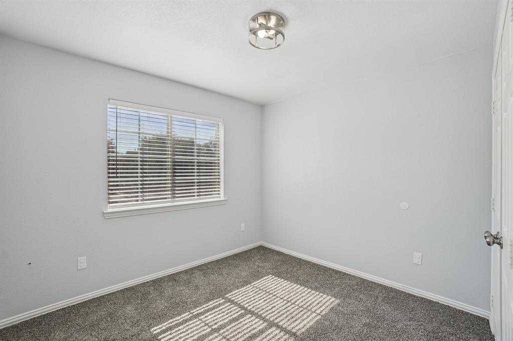 4021 Preferred Place Dallas, TX 75237 - Photo 18 of 25 a view of an empty room with a window