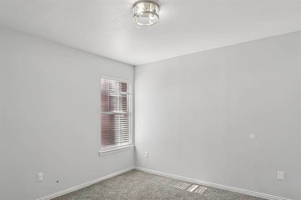 4021 Preferred Place Dallas, TX 75237 - Photo 19 of 25 a view of an empty room with a window