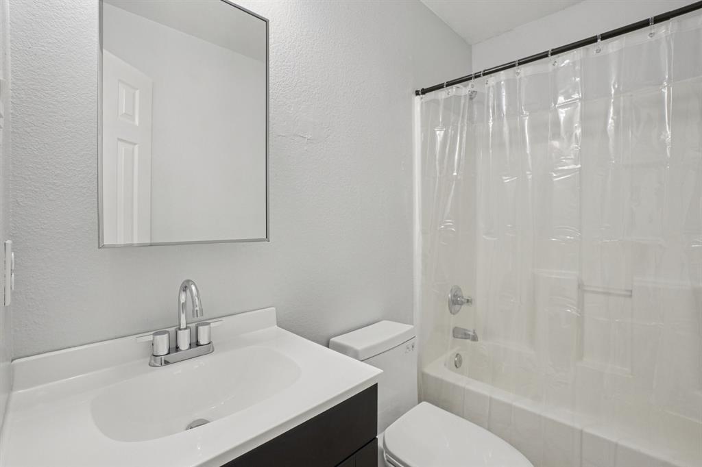 4021 Preferred Place Dallas, TX 75237 - Photo 21 of 25 a bathroom with a sink toilet and shower