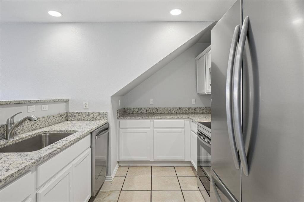 4021 Preferred Place Dallas, TX 75237 - Photo 7 of 25 a kitchen with a sink stove and refrigerator