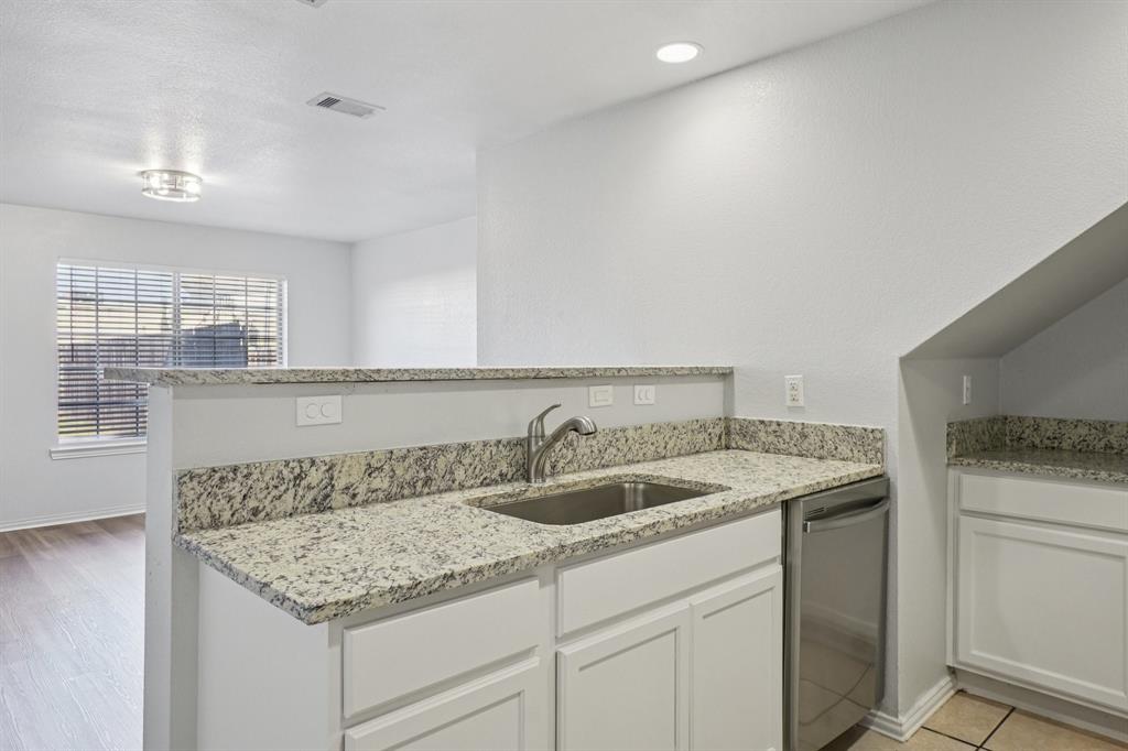 4021 Preferred Place Dallas, TX 75237 - Photo 9 of 25 a kitchen with a sink and cabinets