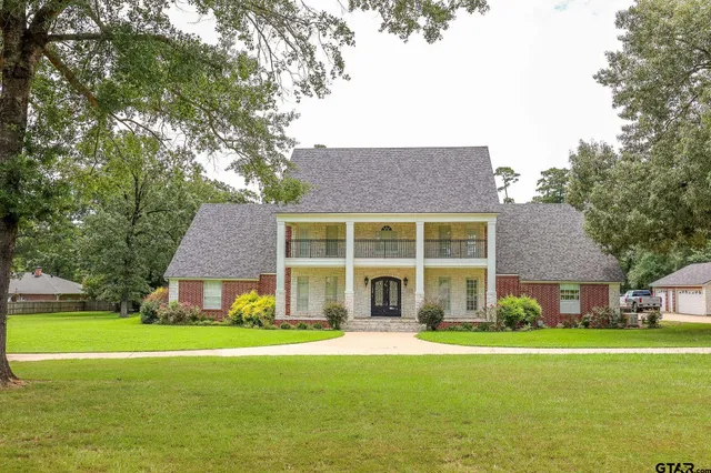 a front view of house with yard and seating area