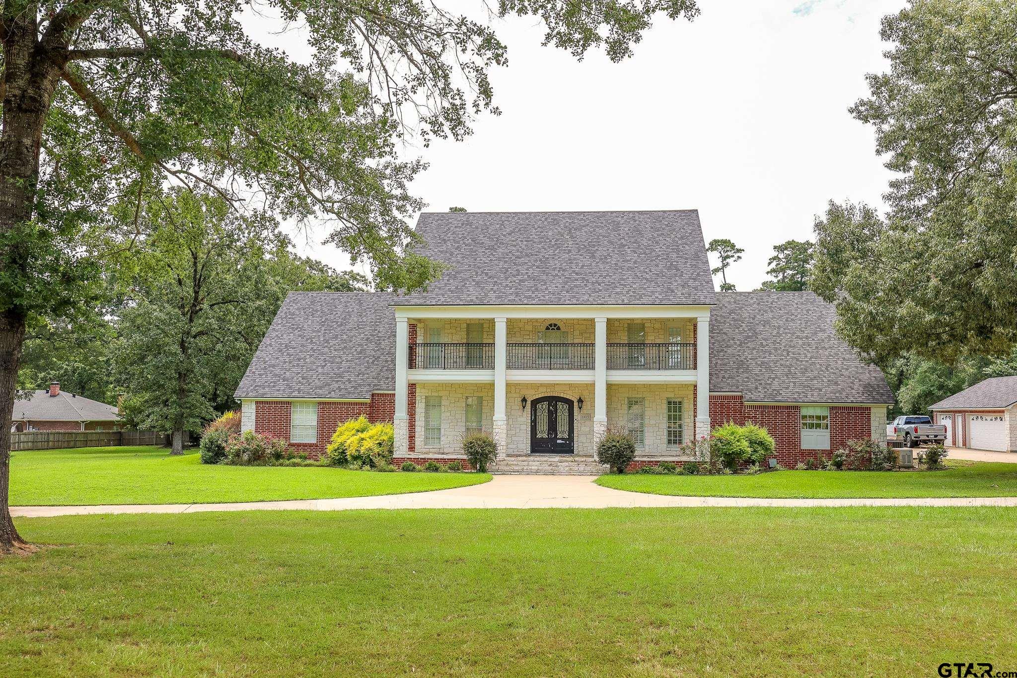 a front view of house with yard and seating area