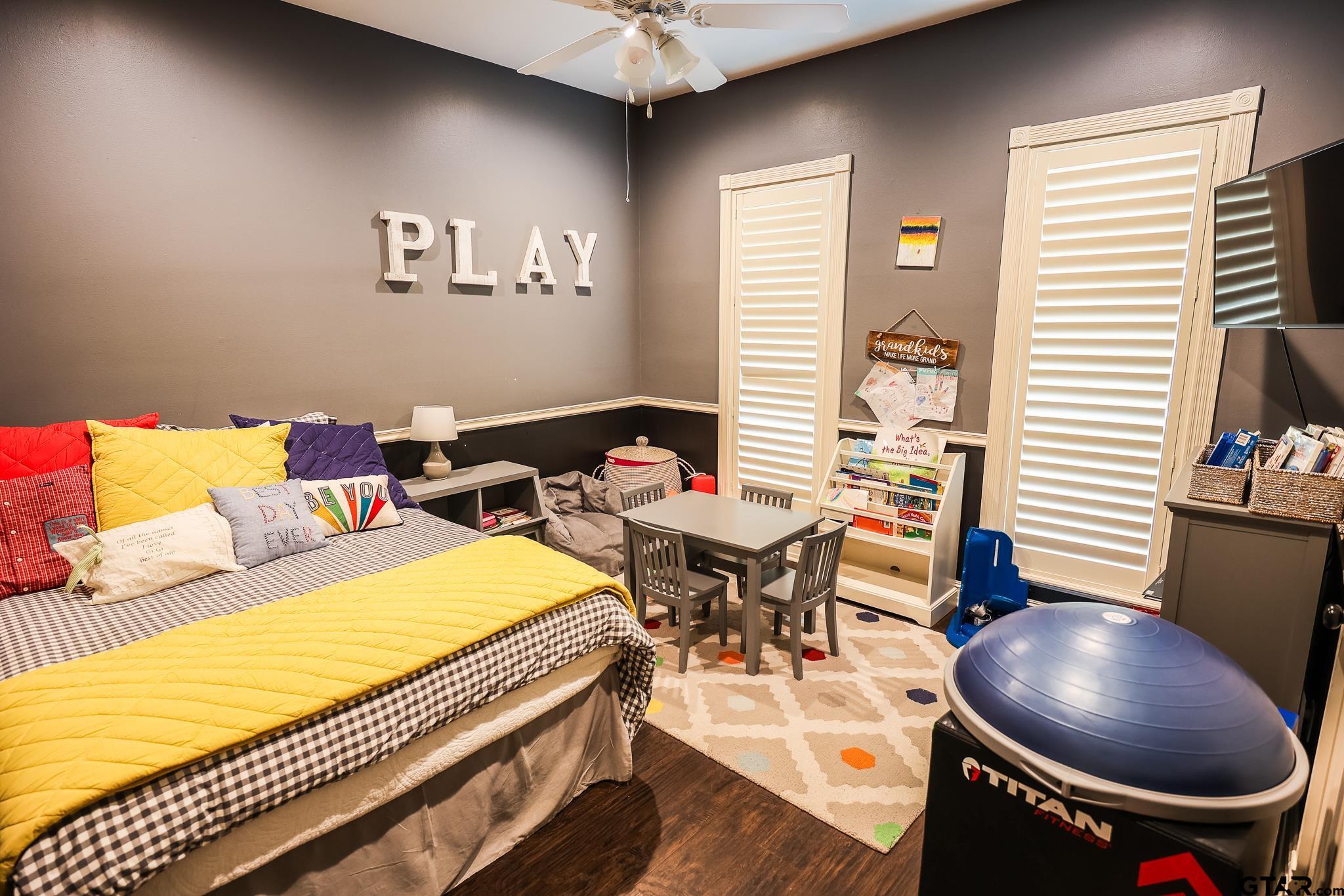 1415 West Sabine Street Carthage, TX 75633 - Photo 13 of 44 a living room with furniture and a wooden floor