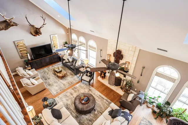 a view of a living room with furniture and a fireplace