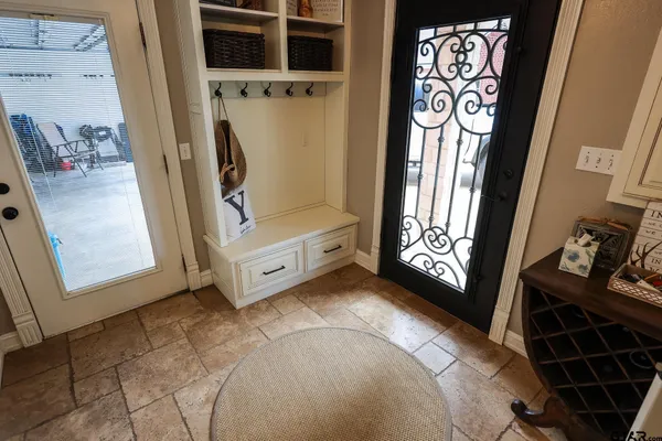 a view of an entryway with wooden floor
