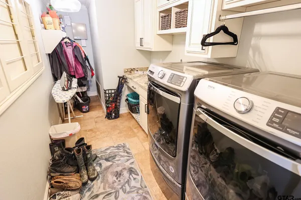 a utility room with dryer and washer
