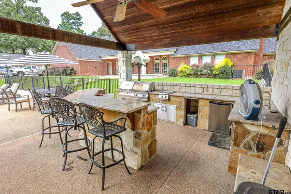 a view of a swimming pool with a patio