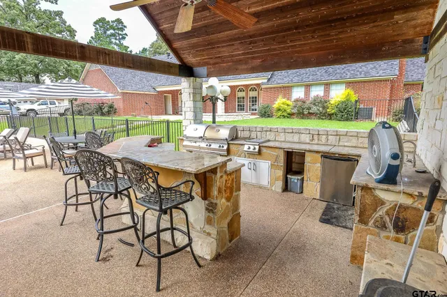 a view of a swimming pool with a patio