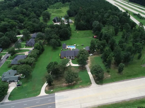 a view of a lake with a yard