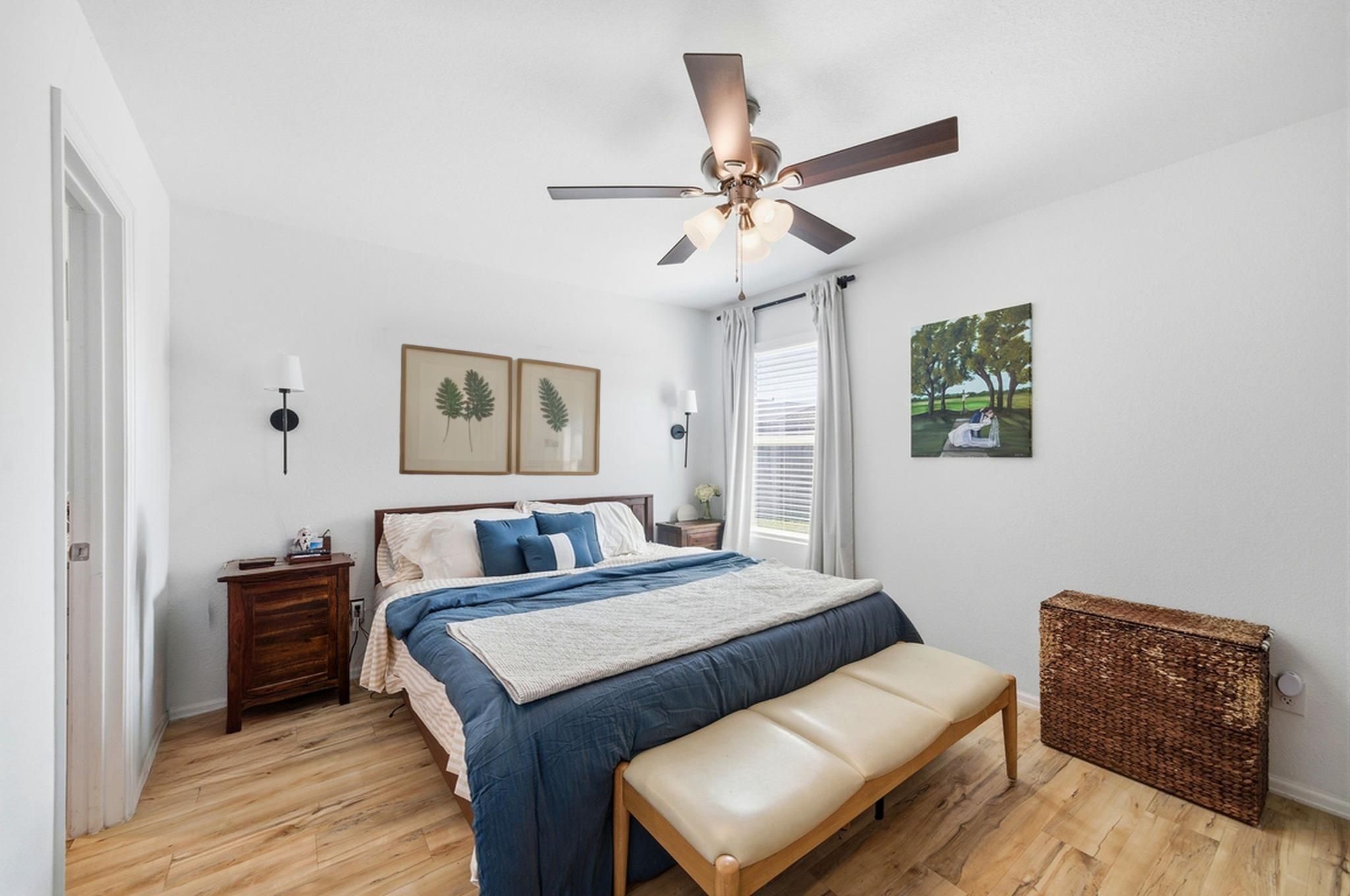 14502 Woodcott Warren Way Rosharon, TX 77583 - Photo 25 of 37 A private primary bedroom located at the rear of the home, designed for relaxation and quiet comfort.