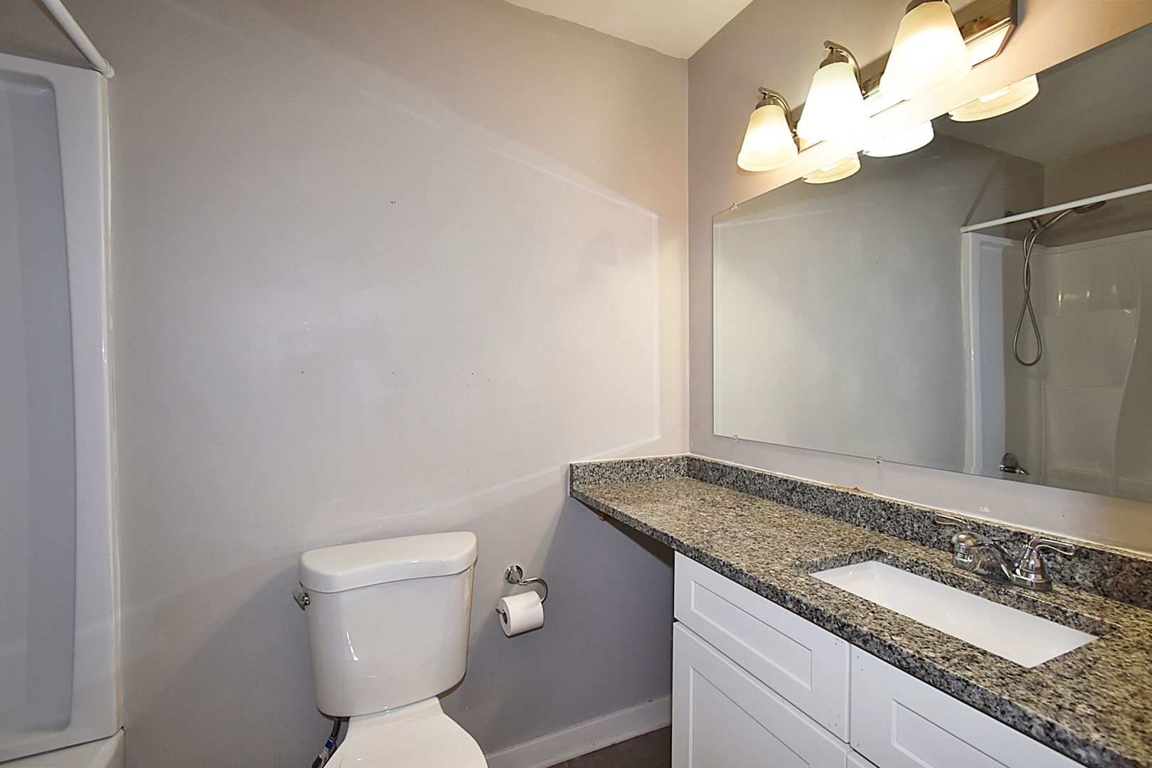 1362 South Glen Circle, Unit A Aurora, IL 60506 - Photo 16 of 17 a bathroom with a granite countertop sink and a mirror
