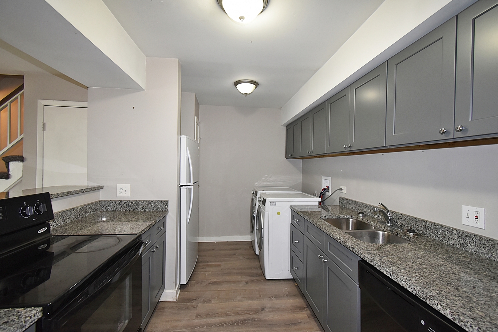 1362 South Glen Circle, Unit A Aurora, IL 60506 - Photo 5 of 17 a kitchen that has a sink and a stove