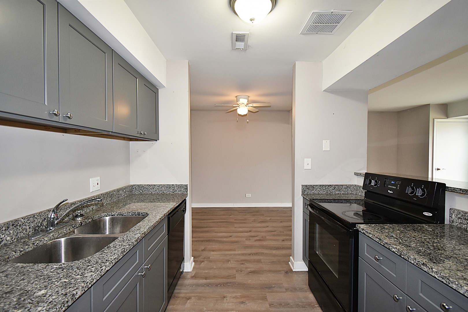 1362 South Glen Circle, Unit A Aurora, IL 60506 - Photo 6 of 17 a kitchen with granite countertop a sink and cabinets