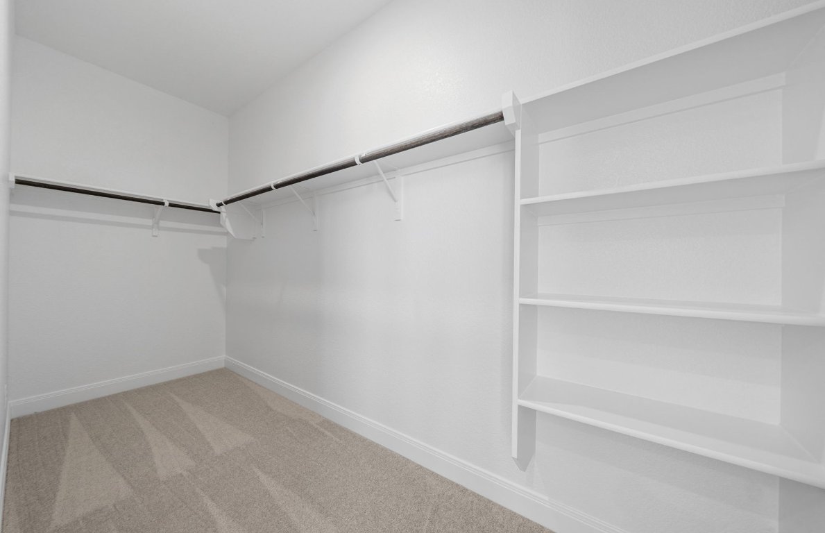 501 Maries Garden Georgetown, TX 78626 - Photo 11 of 24 a view of an empty walk in closet