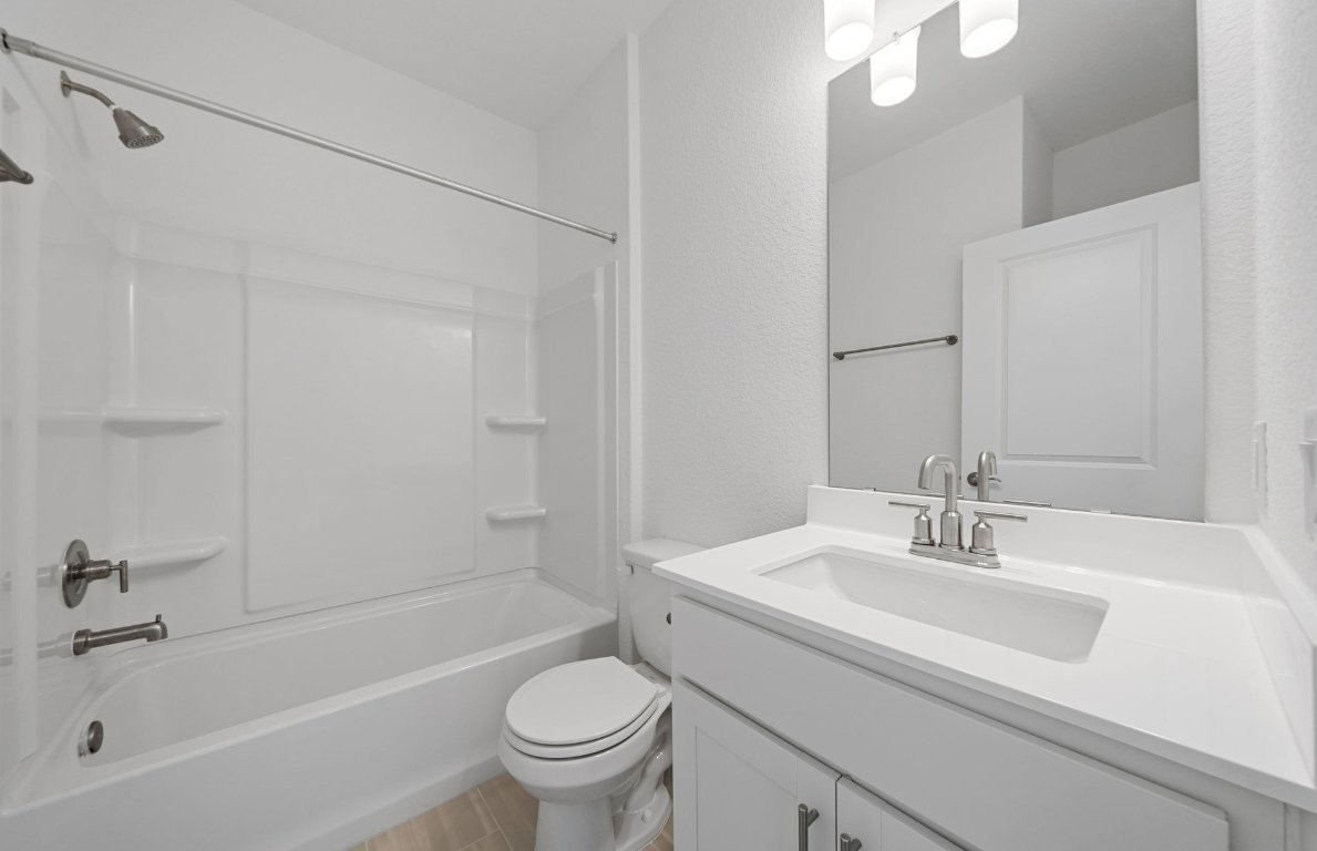 501 Maries Garden Georgetown, TX 78626 - Photo 17 of 24 a bathroom with a sink a toilet and a bathtub