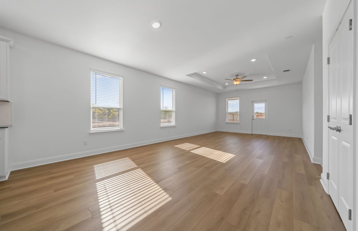 501 Maries Garden Georgetown, TX 78626 - Photo 7 of 24 wooden floor in an empty room with a window