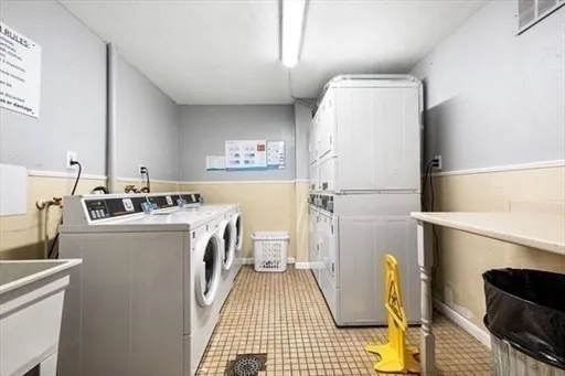 a kitchen with a refrigerator and a stove