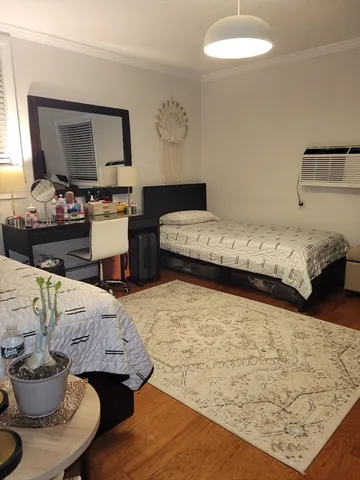 a bedroom with a bed and couch