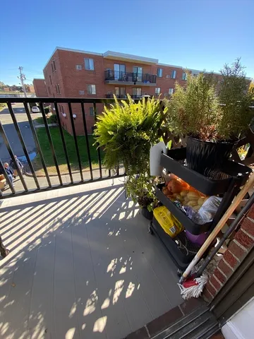a view of a balcony with chairs