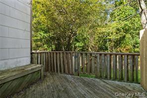 231 Hill Rise Calverton, NY 11933 - Photo 13 of 14 a view of a backyard with wooden fence