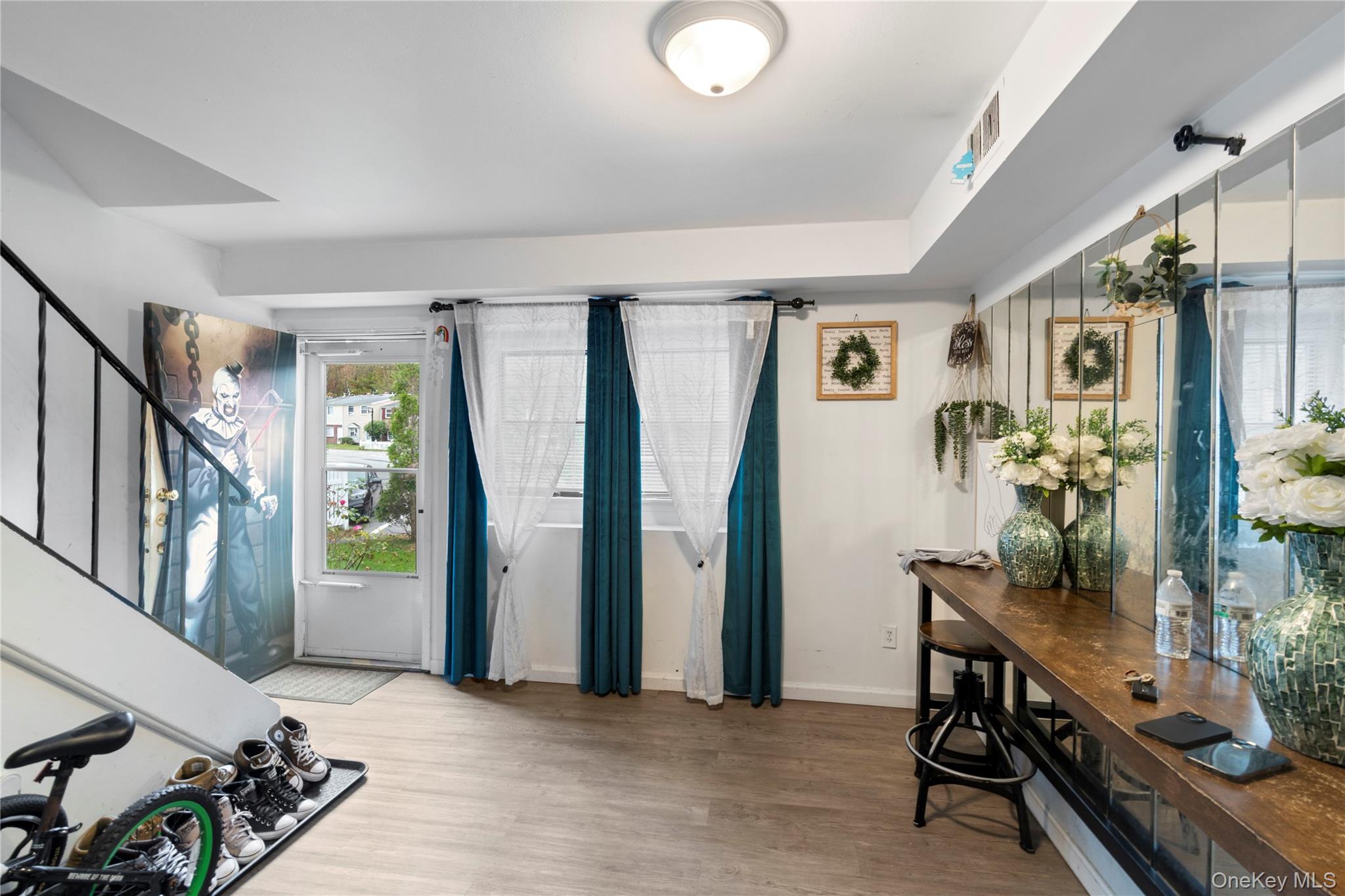 231 Hill Rise Calverton, NY 11933 - Photo 5 of 14 a view of a livingroom with furniture and front door