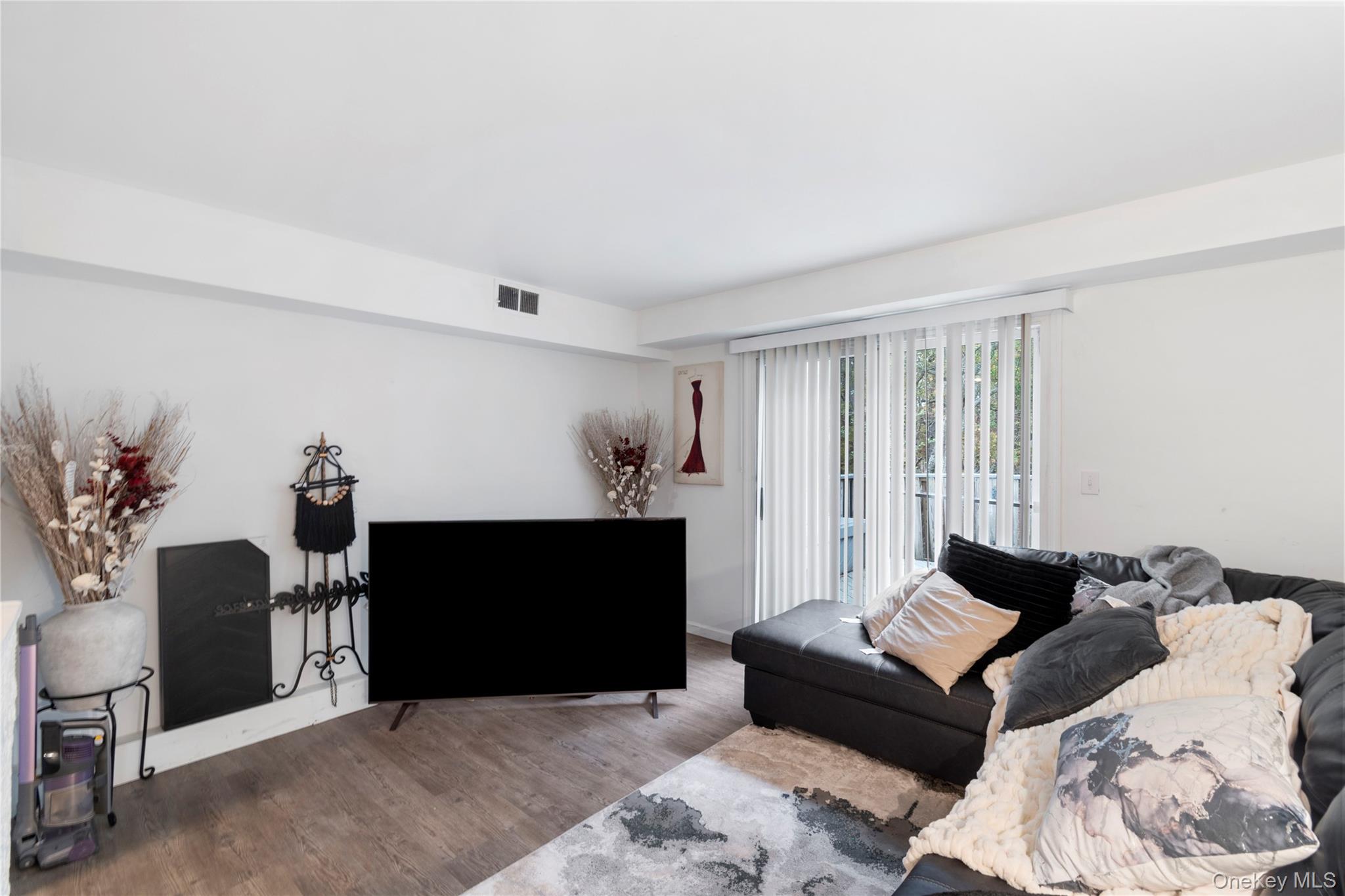 231 Hill Rise Calverton, NY 11933 - Photo 8 of 14 a living room with furniture and a fireplace