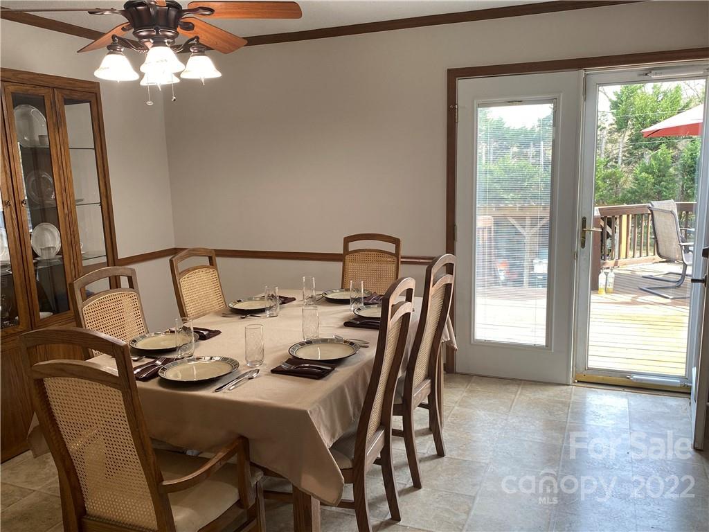 1539 Cobblestone Court Fort Mill, SC 29708 - Photo 13 of 41 a view of a dining room with furniture and a chandelier