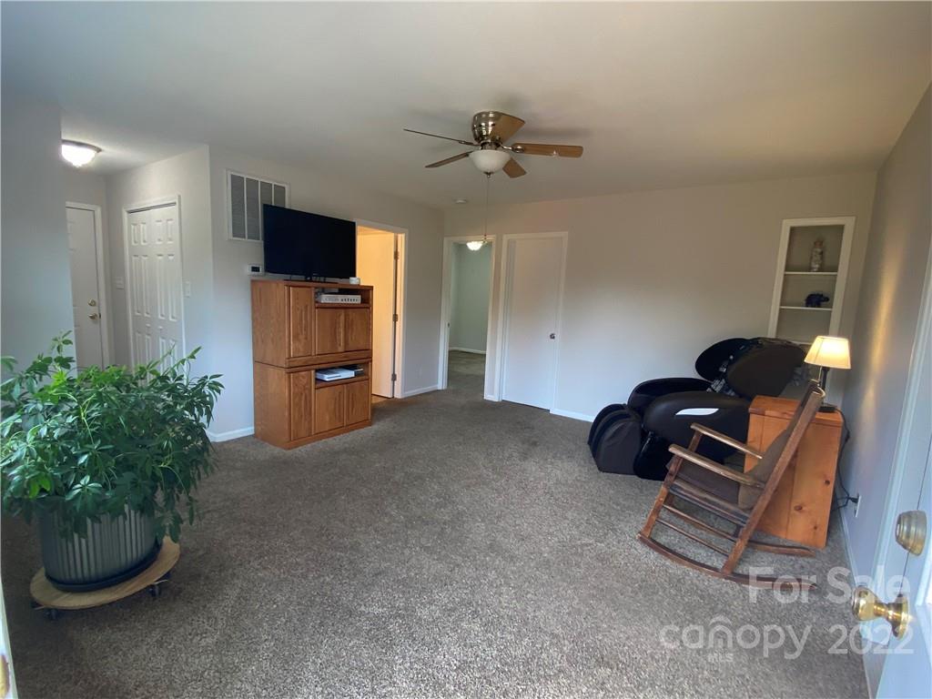 1539 Cobblestone Court Fort Mill, SC 29708 - Photo 19 of 41 a living room with furniture and a flat screen tv