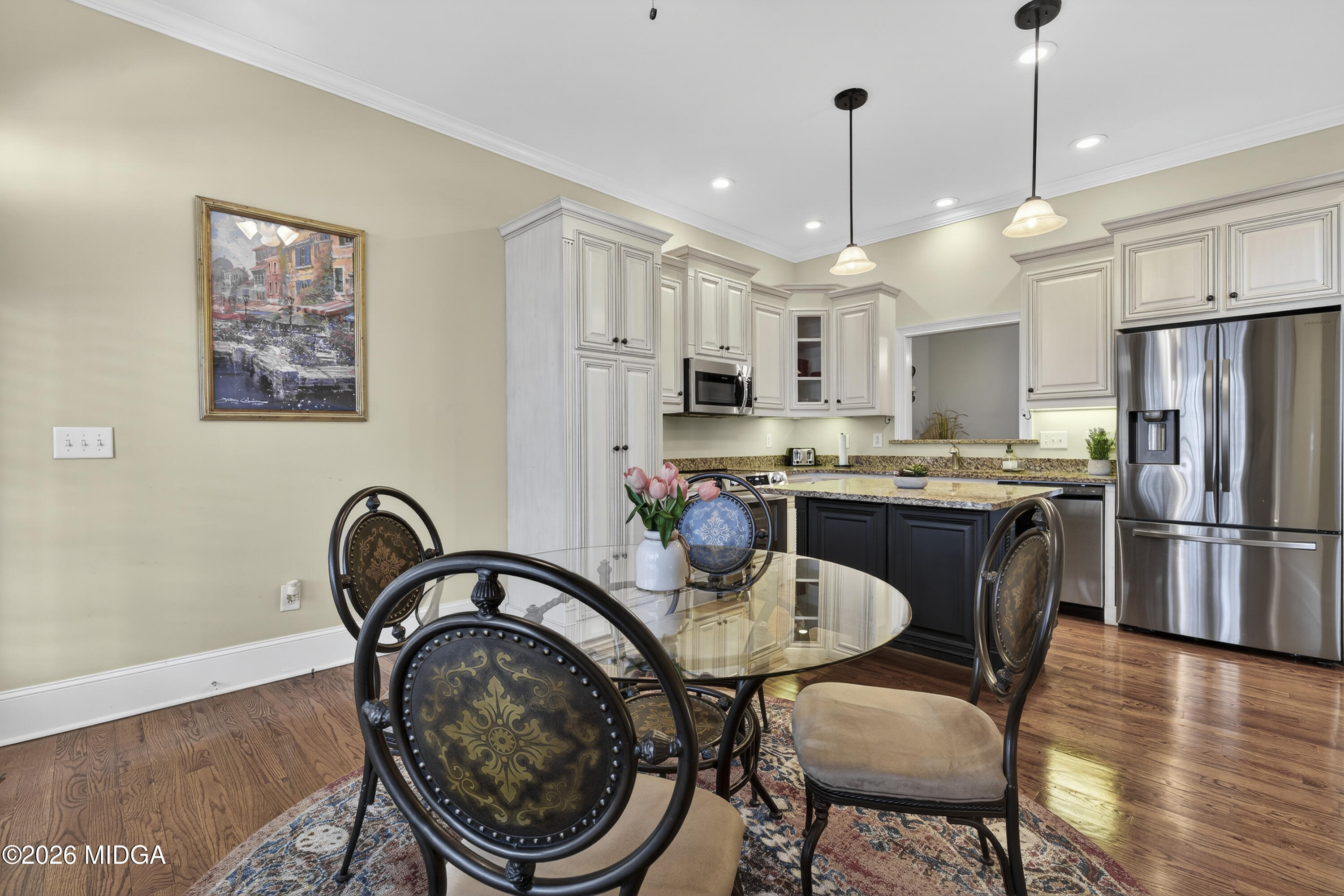 855 Tufthunter Macon, GA 31210 - Photo 27 of 86 a kitchen with stainless steel appliances granite countertop a dining table chairs refrigerator and sink