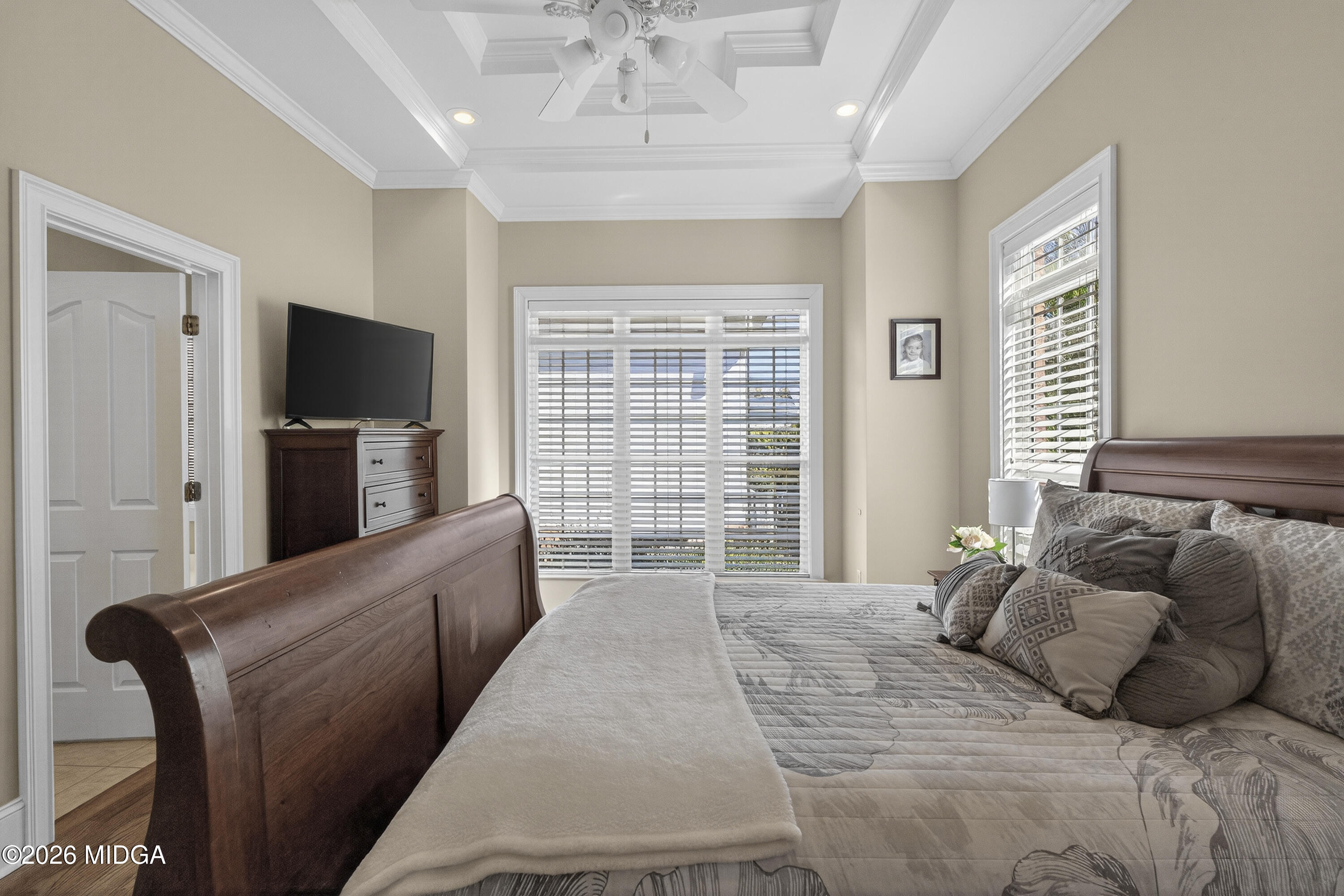 855 Tufthunter Macon, GA 31210 - Photo 31 of 86 a bedroom with a large bed and a flat tv screen