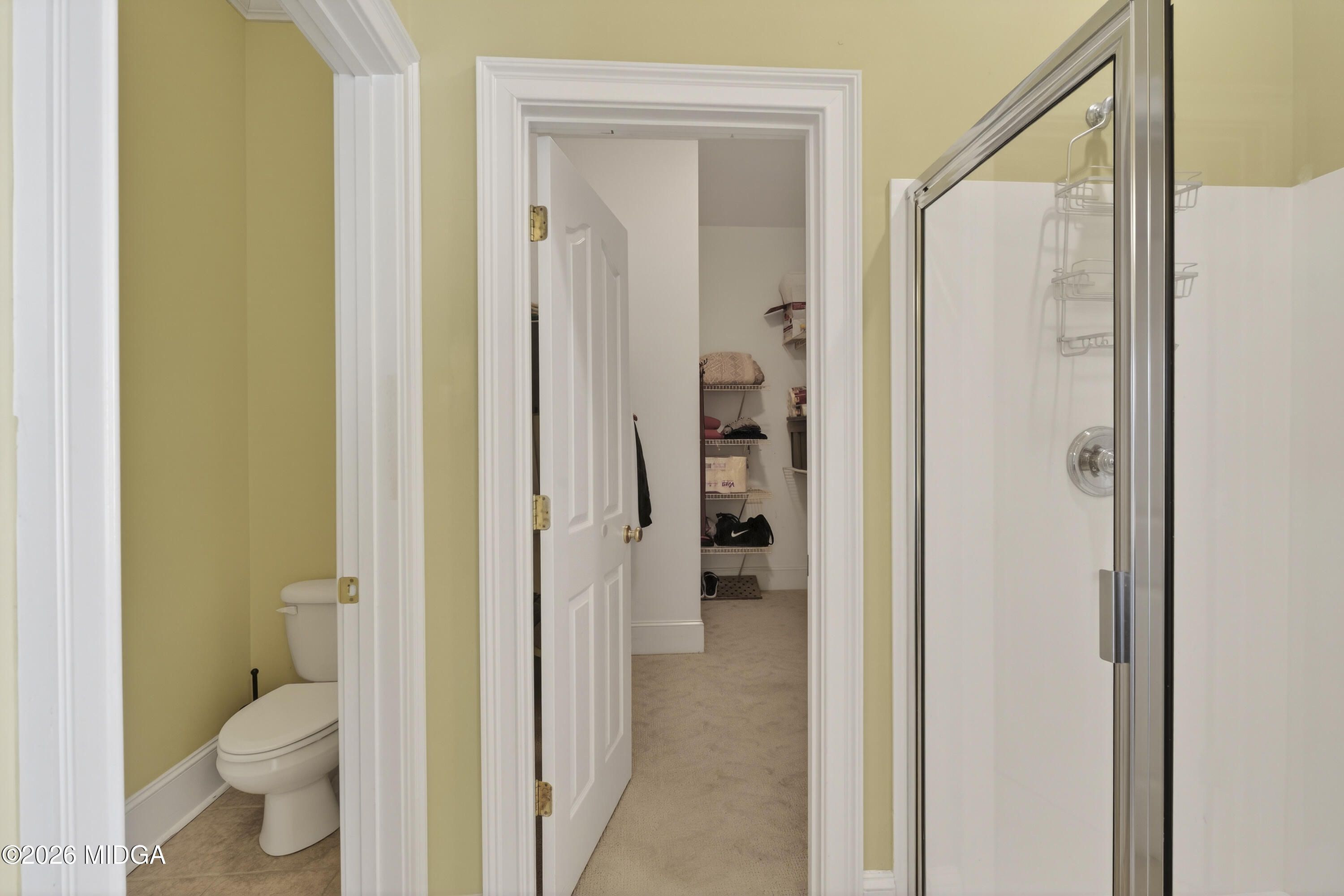 855 Tufthunter Macon, GA 31210 - Photo 39 of 87 a bathroom with a granite countertop toilet a sink and a mirror