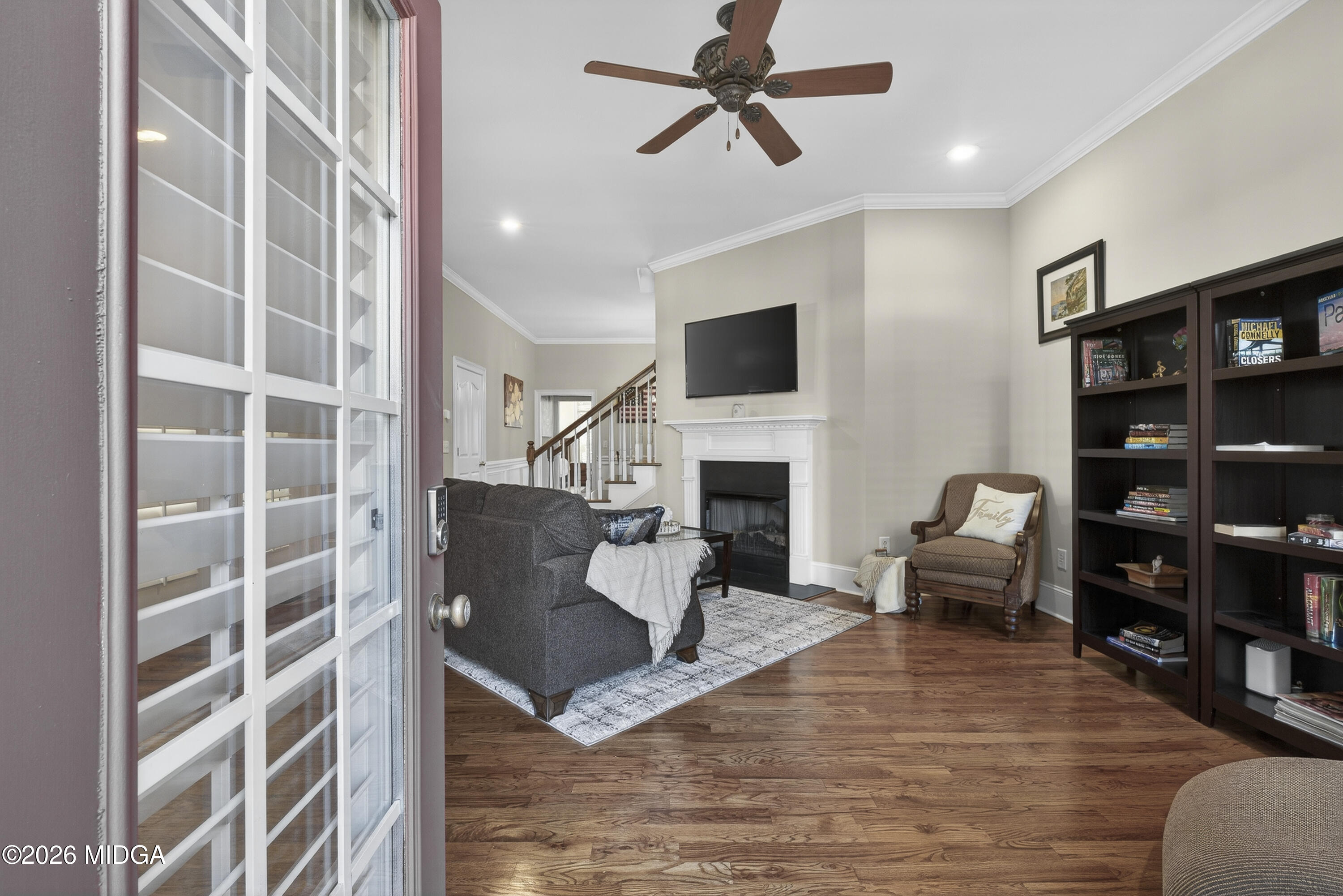 855 Tufthunter Macon, GA 31210 - Photo 6 of 87 a living room with furniture a fireplace and a flat screen tv