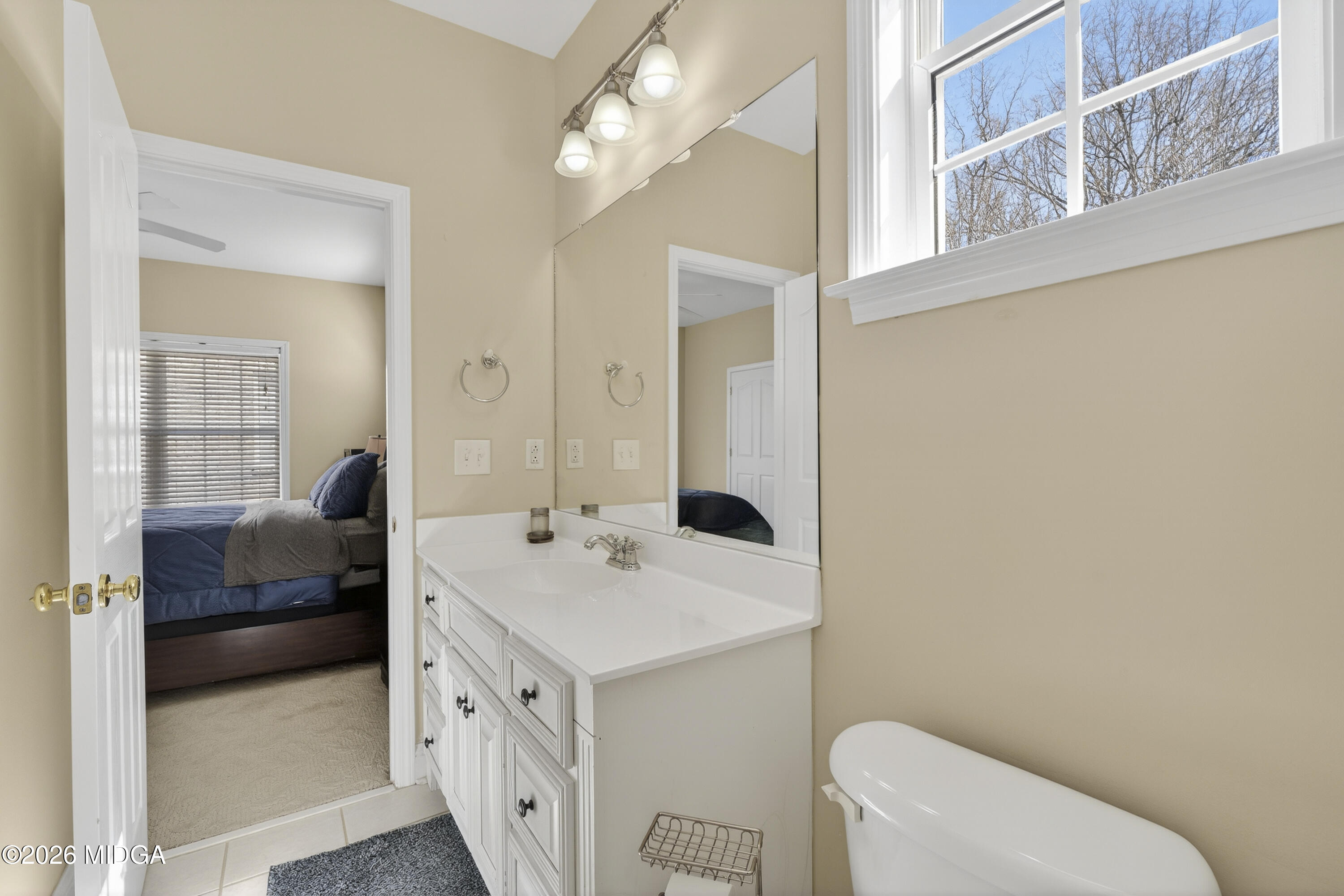 855 Tufthunter Macon, GA 31210 - Photo 65 of 86 a spacious bathroom with a double vanity sink toilet and a mirror